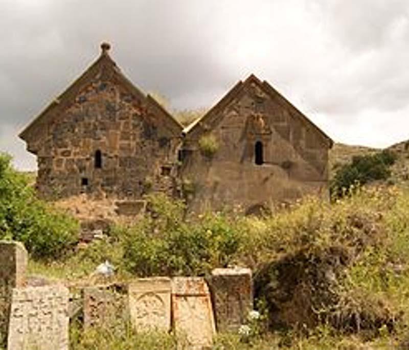 Herher, depicting a small village set in a valley with traditional architecture and surrounding natural beauty.