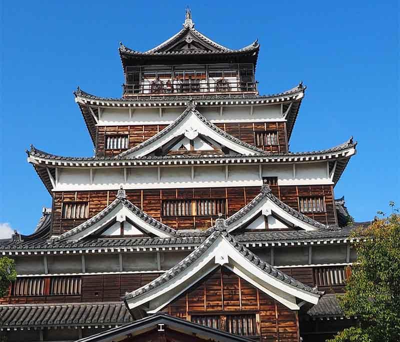 Hiroshima Castle, a reconstructed castle surrounded by a moat, now housing a museum dedicated to Hiroshima's history.