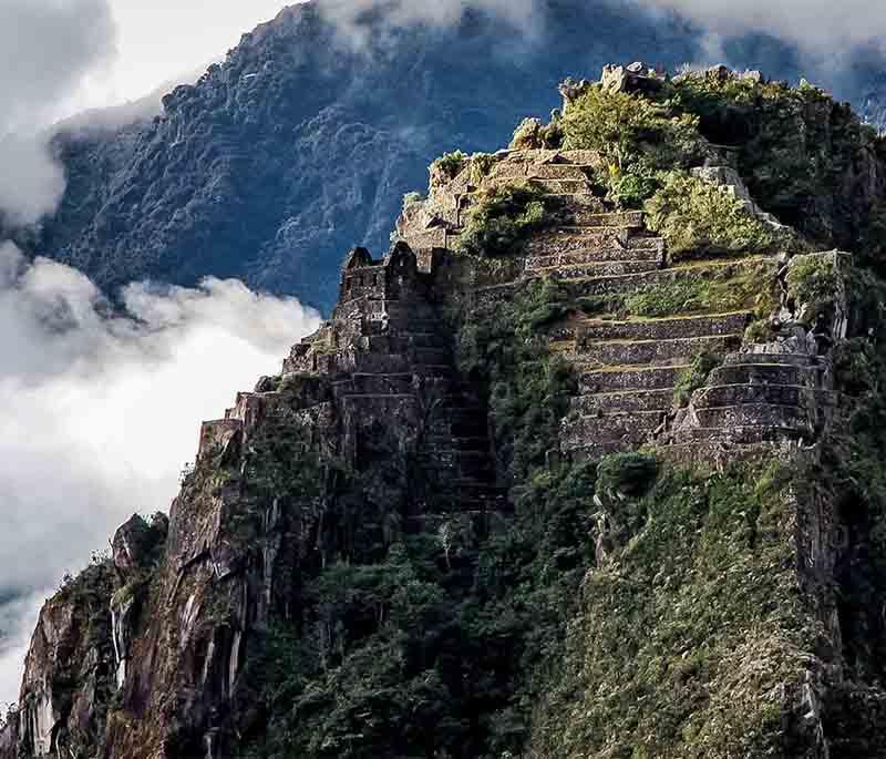 Huayna Picchu - The iconic peak overlooking Machu Picchu, offering challenging hikes and breathtaking views.