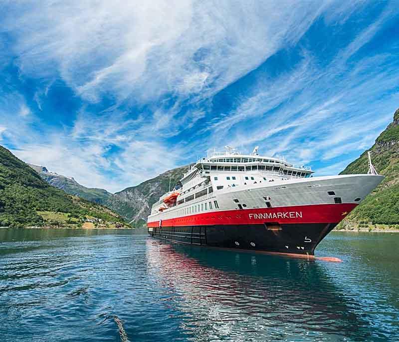 Hurtigruten Coastal Voyage - A scenic coastal cruise that showcases Norway’s stunning fjords and coastline.