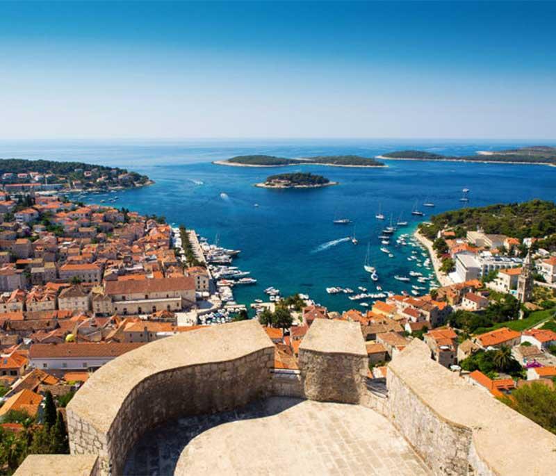 Hvar Island, renowned for its beautiful beaches, vibrant nightlife, and historic sites, including the Fortica Fortress.