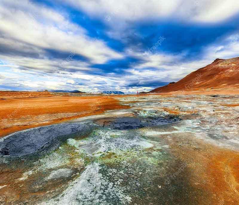 Hverarond Geothermal Area, a geothermal field near Lake Myvatn, known for its bubbling mud pots and steaming fumaroles.