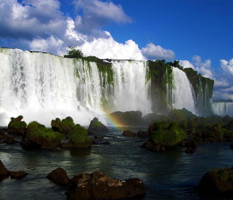 Iguazu Falls in Misiones, capturing the breathtaking views of massive waterfalls amidst lush subtropical forest, stunning.