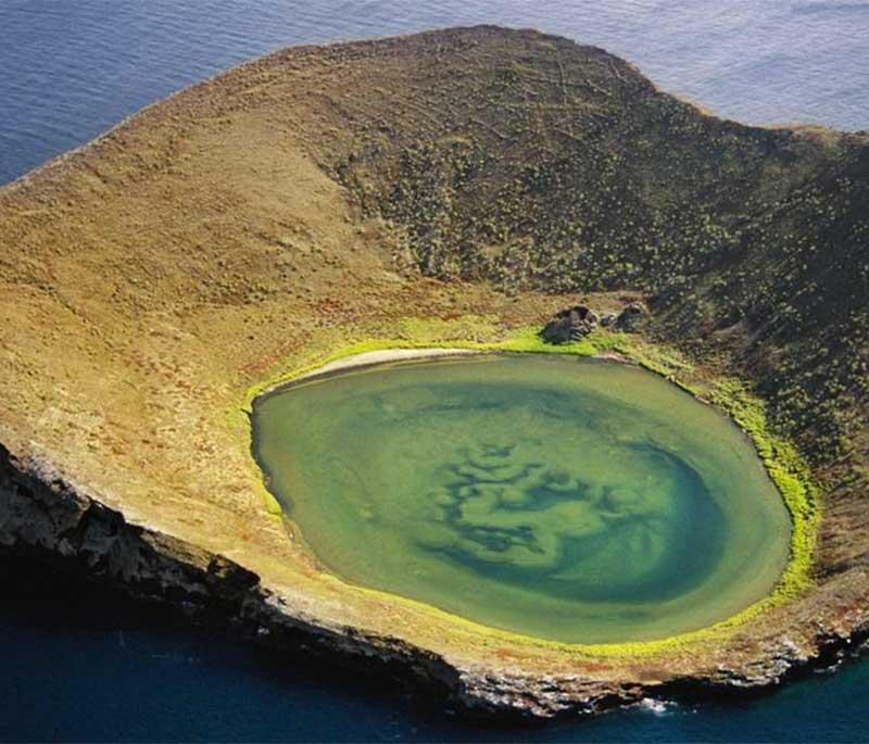 Isabela Island, the largest island in the Galapagos, known for its volcanic landscapes, wildlife, and snorkeling spots.