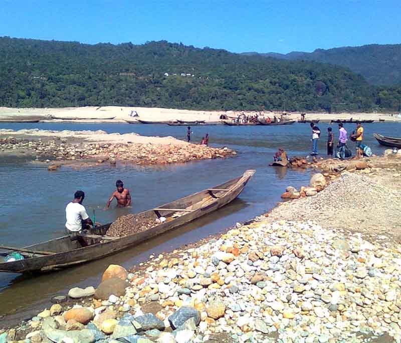 Jaflong, Sylhet, presenting the picturesque area known for its rolling hills, tea gardens, and stone collection activities.