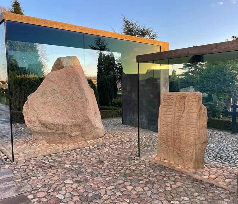 Jelling Monuments, a UNESCO site with ancient runestones, burial mounds, and a church, marking the birthplace of Denmark.