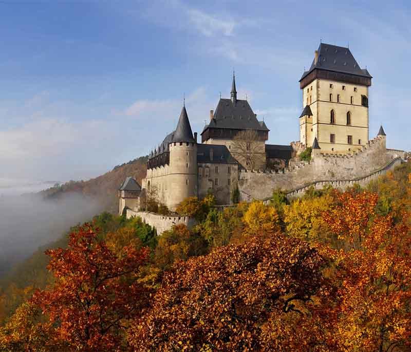 Karlstejn Castle, a Gothic castle founded by Emperor Charles IV, housing royal treasures and offering panoramic views.