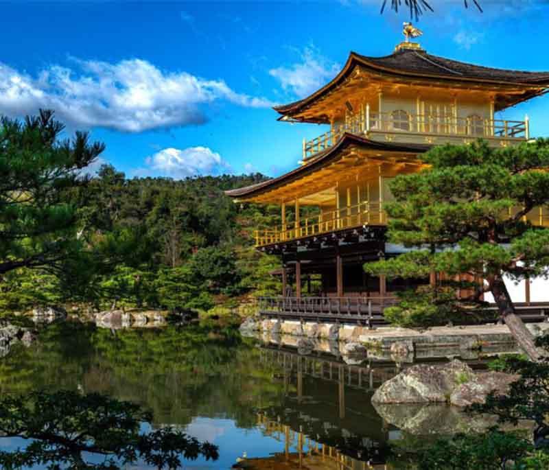 Kinkaku-ji (Golden Pavilion), a Zen temple in Kyoto covered in gold leaf, known for its stunning beauty and reflecting pond.