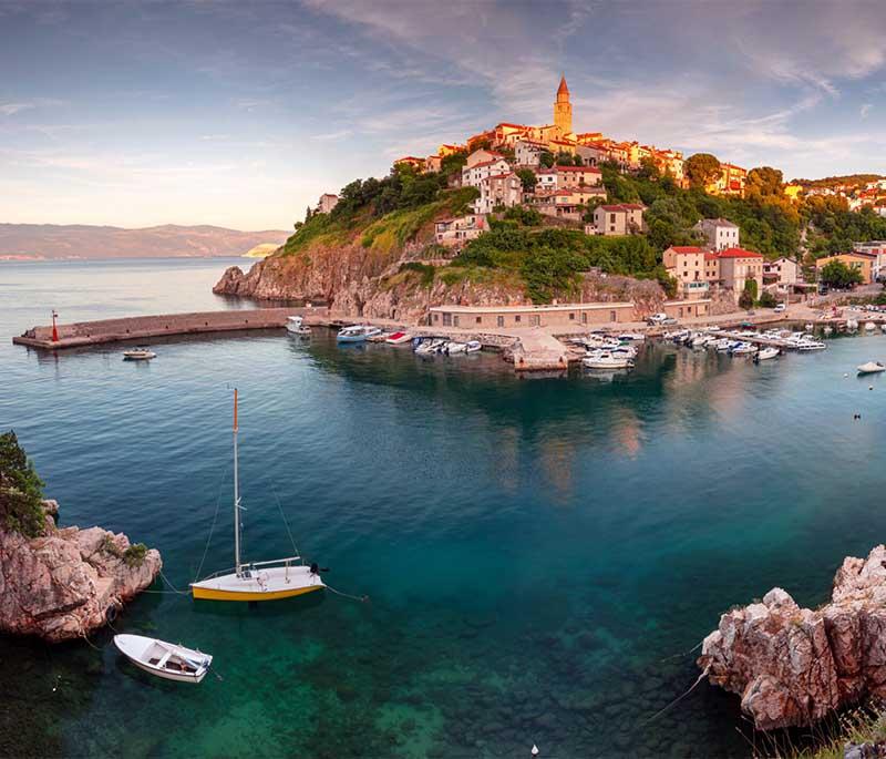 Krk Island, the largest Adriatic island, known for its beautiful beaches, historic towns, and diverse landscapes.