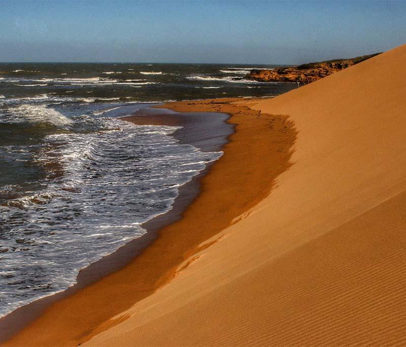 La Guajira Desert, a vast and arid region with unique landscapes, indigenous Wayuu culture, and the stunning Cabo de la Vela.