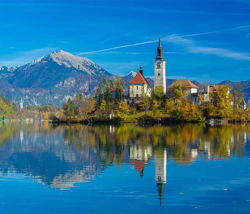 Lake Bled - A picturesque lake with an island and castle, known for its stunning beauty and recreational activities.