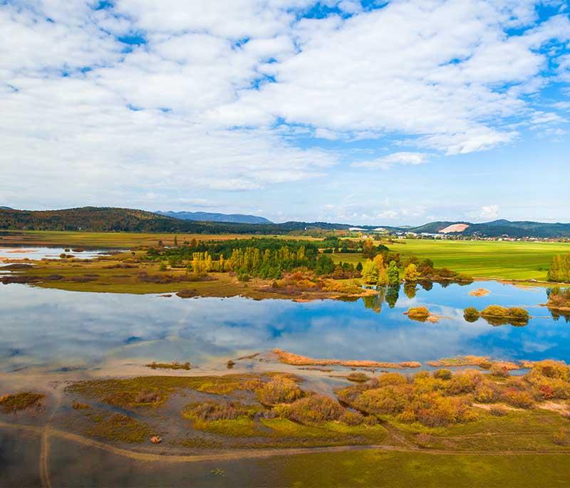 Lake Cerknica - A unique intermittent lake known for its changing water levels and diverse ecosystem.