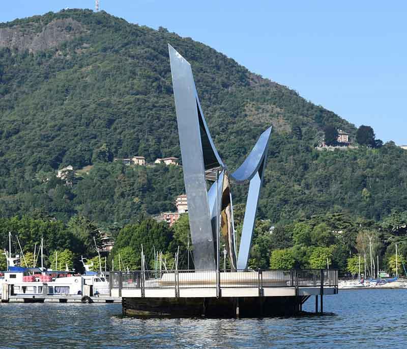 Lake Como, Lombardy, a scenic lake surrounded by mountains and charming towns, known for its beautiful villas and gardens.