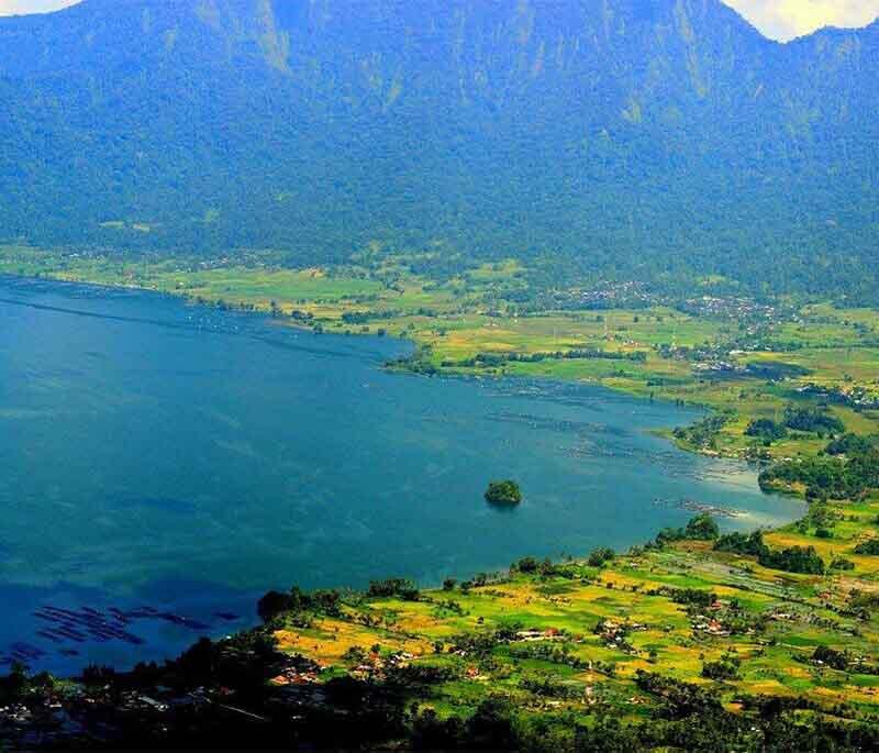 Lake Maninjau, West Sumatra, a volcanic lake known for its stunning scenery and tranquil environment.