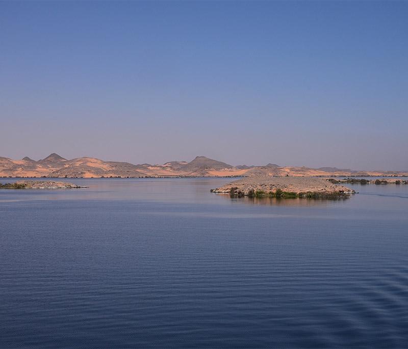 Lake Nasser, a vast artificial lake created by the Aswan High Dam, offering fishing, boating, and views of submerged temples.