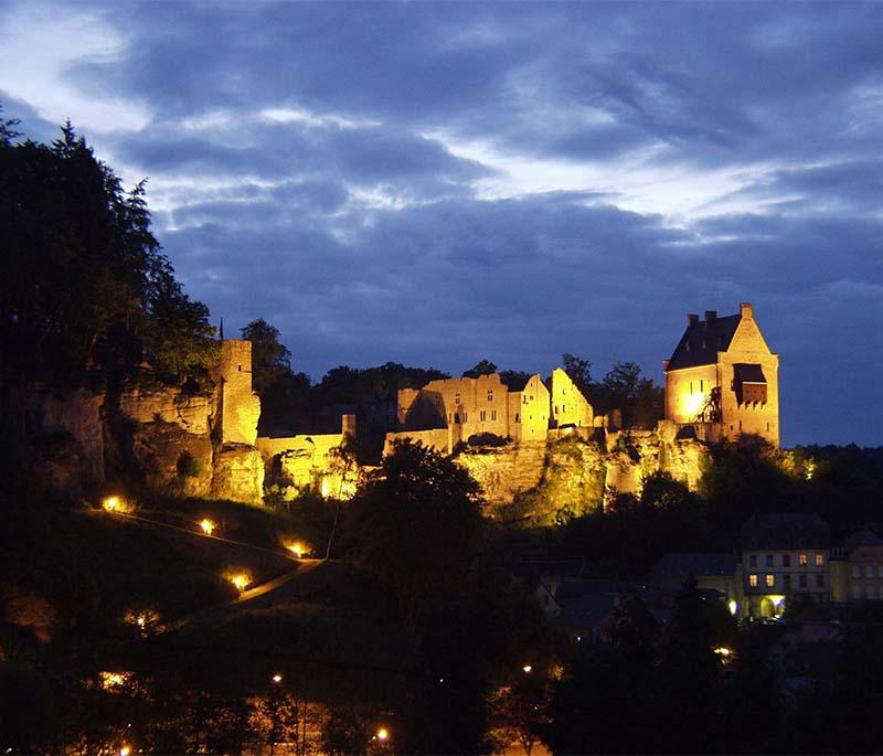 Larochette Castle, the ruins of a medieval castle located on a rocky outcrop, offering scenic views of the surrounding area.