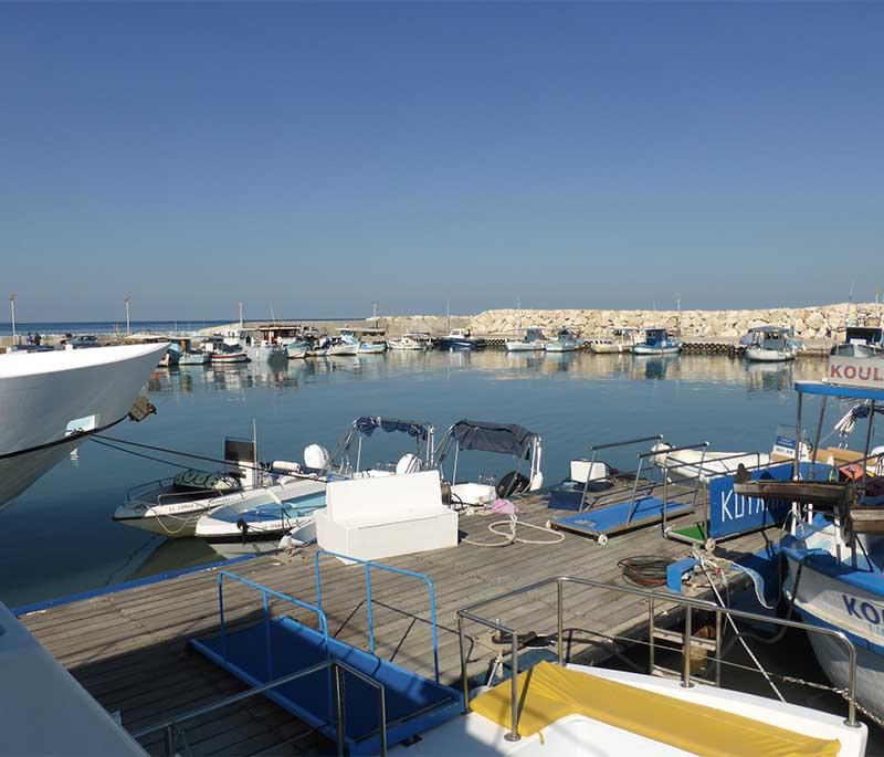 Latchi Harbor and Baths of Aphrodite, featuring a charming harbor with seafood restaurants and the nearby Baths of Aphrodite.