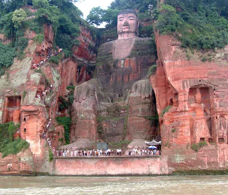 Leshan Giant Buddha in Sichuan is an iconic monumental statue facing Mount Emei, with the rivers flowing below.