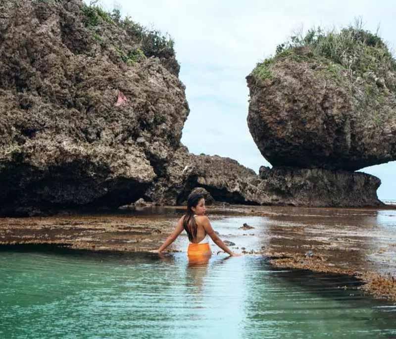 Magpupungko Rock Pools - Natural rock pools in Siargao, popular for swimming, cliff diving, and stunning turquoise waters.