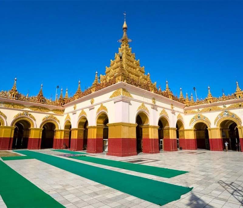 Mahamuni Buddha Temple, Mandalay - Houses a highly revered Buddha image covered in gold leaf, with rich history.