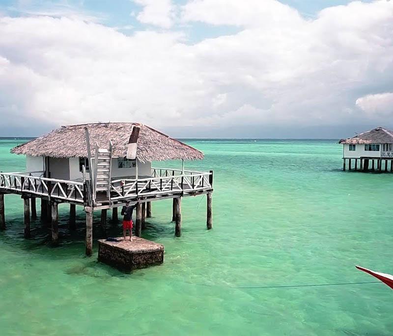 Manjuyod Sandbar - Dubbed the Maldives of the Philippines, known for its white sand, clear waters, and picturesque setting.