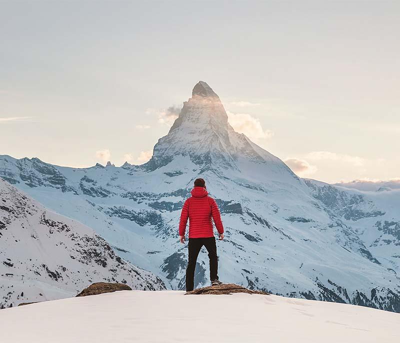 Matterhorn - Iconic peak in the Alps, renowned for mountaineering and skiing adventures with its distinctive pyramid shape.