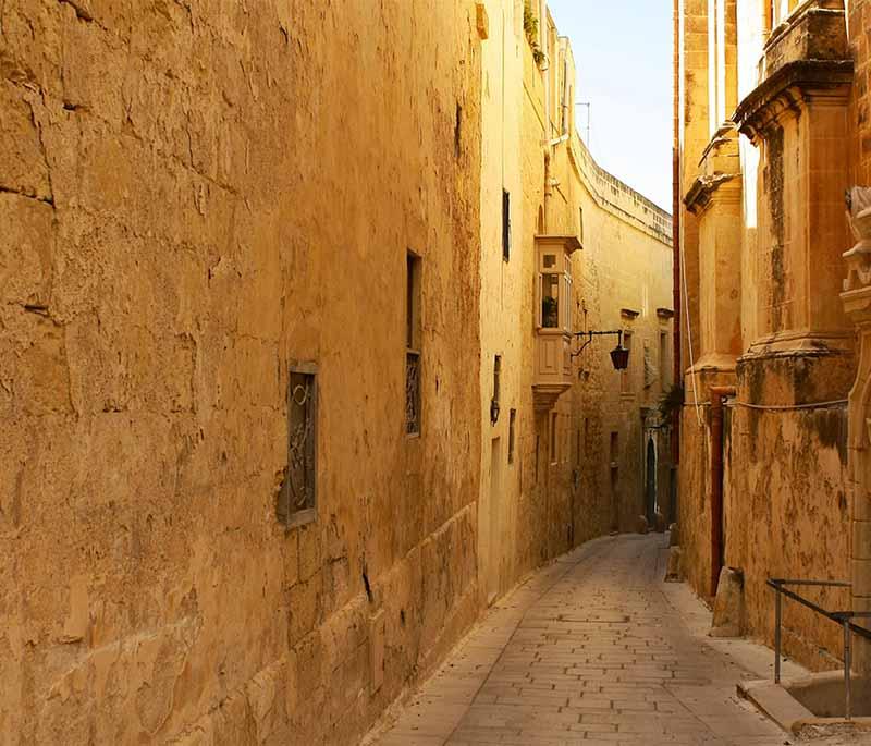Mdina, an ancient walled city, offers narrow streets and a glimpse into Malta’s medieval past and rich history.