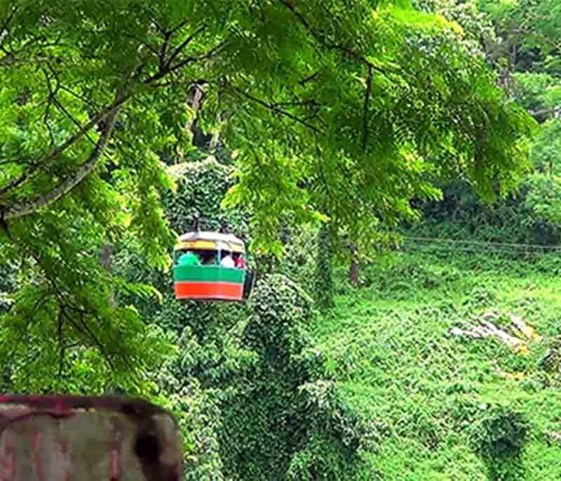 Meghla Tourist Complex, Bandarban, highlighting the popular tourist spot with a lake, hanging bridge, and scenic views.