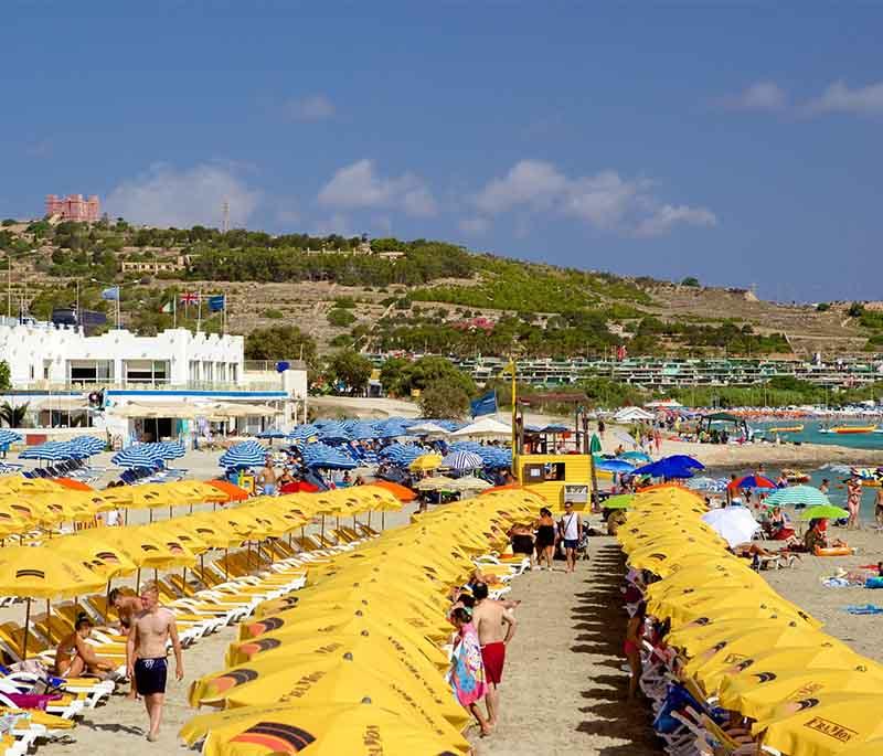 Mellieħa Bay, a picturesque sandy beach, is ideal for families, water sports enthusiasts, and sunbathing.