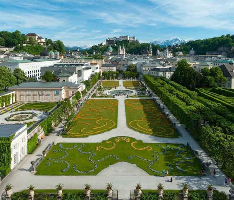 Mirabell Palace and Gardens in Salzburg are famous for their intricate baroque garden designs and historical significance.