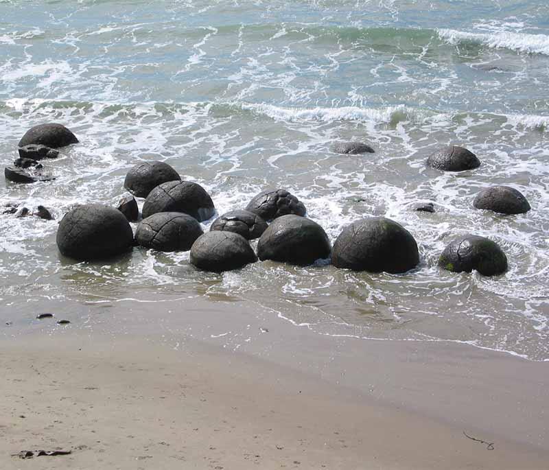 Moeraki Boulders, Otago - Mysterious spherical boulders scattered along Koekohe Beach, attracting photographers.