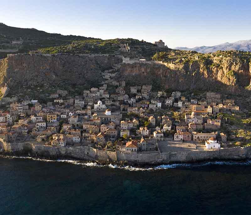 Monemvasia, a medieval fortress town on a small island off the Peloponnese coast, known for its well-preserved buildings.