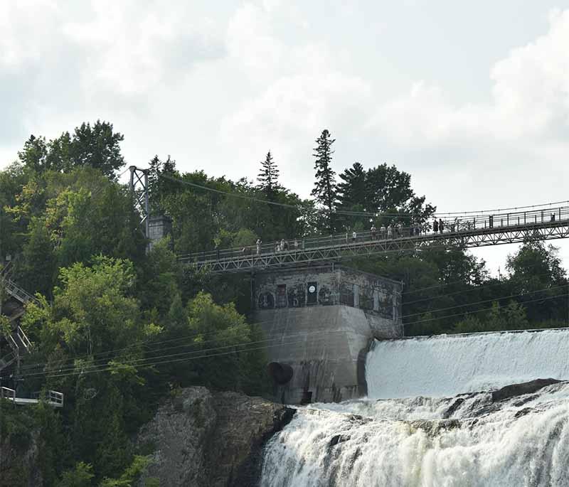 Montmorency Falls in Quebec, higher than Niagara Falls, is a spectacular site with a suspension bridge and cable car.