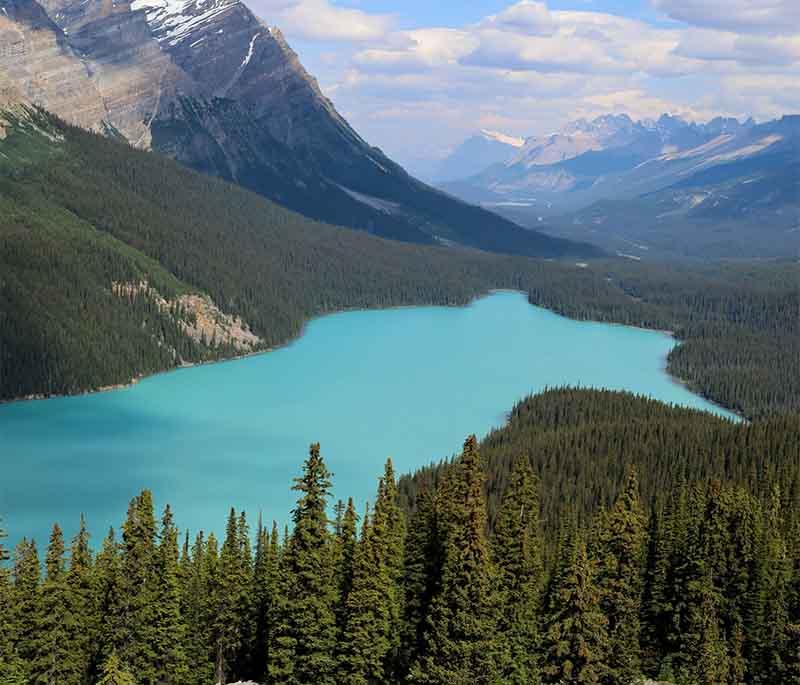 Moraine Lake in Alberta is renowned for its distinctive turquoise waters set against the dramatic Valley of the Ten Peaks.