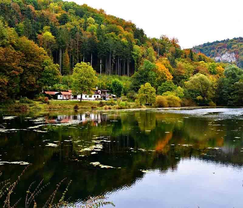 Moravian Karst, a protected landscape area with stunning limestone formations, caves, and underground rivers.