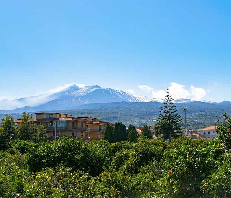 Mount Etna, Sicily, one of the most active volcanoes in the world, offering hiking trails and spectacular views.