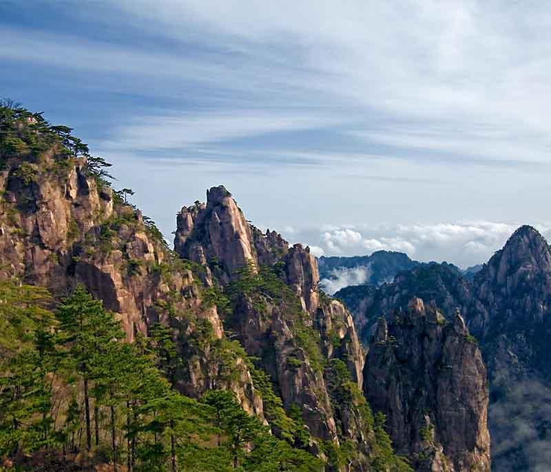 Mount Huangshan in Anhui is admired for its sunrises, peculiarly shaped granite peaks, and pine trees.