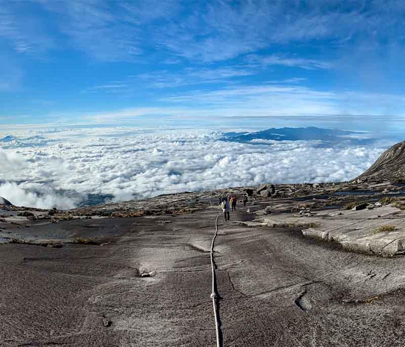 Mount Kinabalu, Sabah: Challenging trek with spectacular views from Malaysia's highest peak, ideal for adventure seekers.