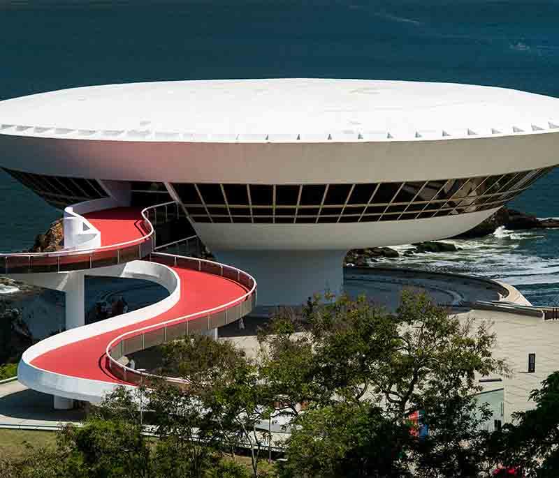 Museu de Arte Contemporânea de Niterói, featuring modern art exhibits in a distinctive building designed by Oscar Niemeyer.