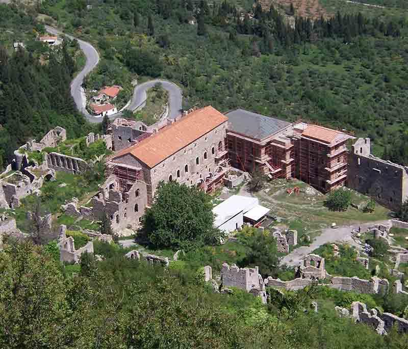 Mystras, a fortified town in the Peloponnese, featuring Byzantine churches, palaces, and a historic castle.