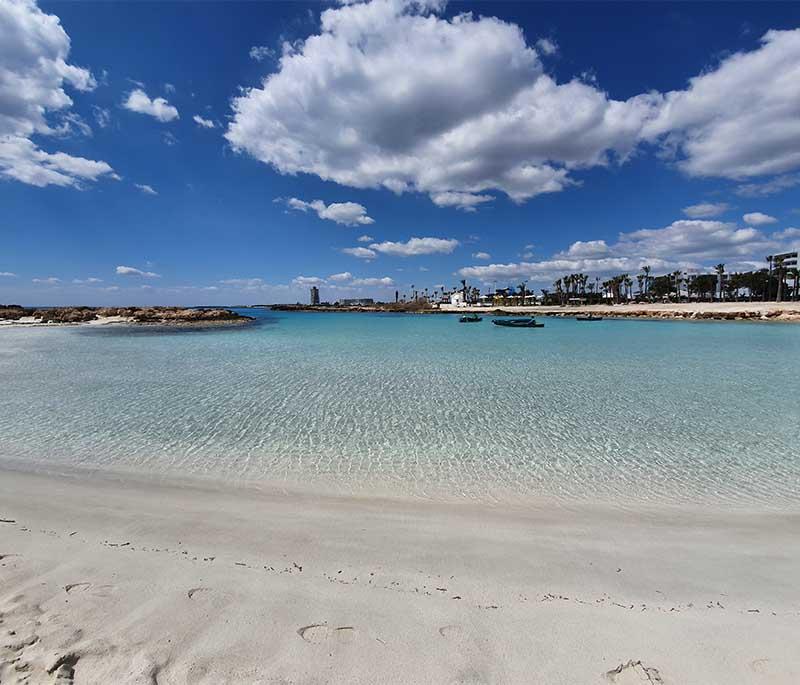 Nissi Beach, a famous beach in Ayia Napa known for its soft white sand, turquoise waters, and lively beach bars.