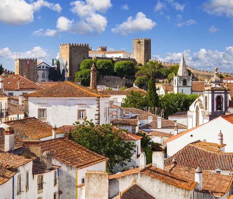 Obidos - A medieval town known for its charming streets and traditional ginjinha liqueur, encircled by ancient walls.