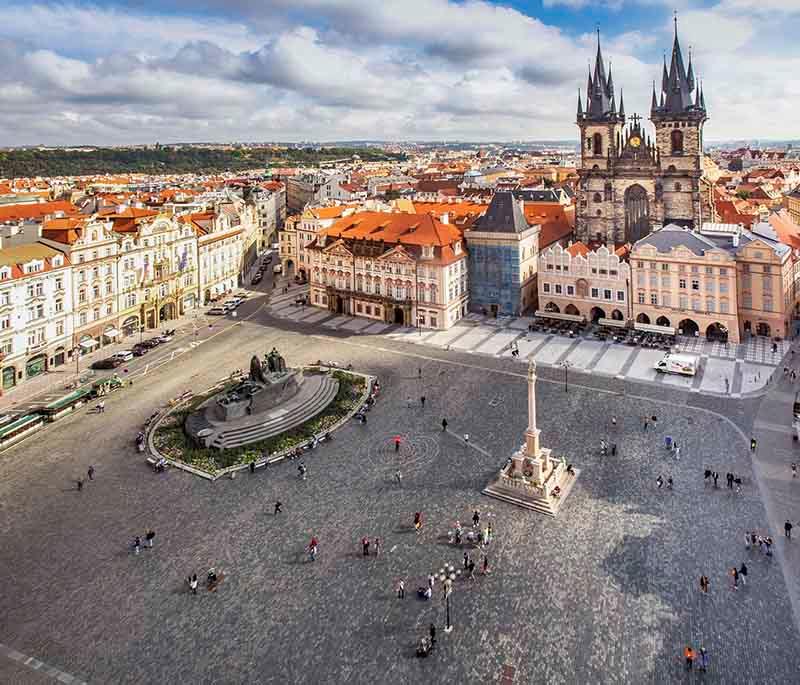 Old Town Square, Prague, a historic square surrounded by Gothic and Baroque buildings, featuring the Astronomical Clock.