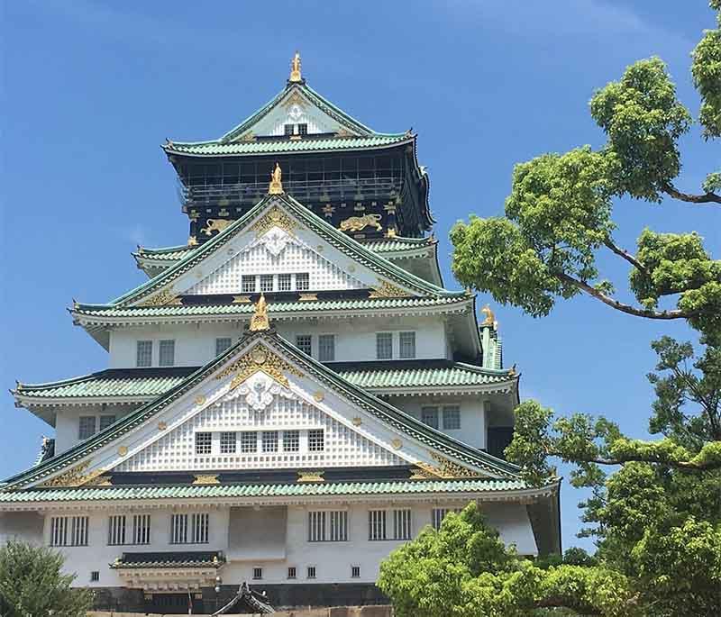 Osaka Castle, a historic castle known for its impressive architecture, museum, and surrounding park.