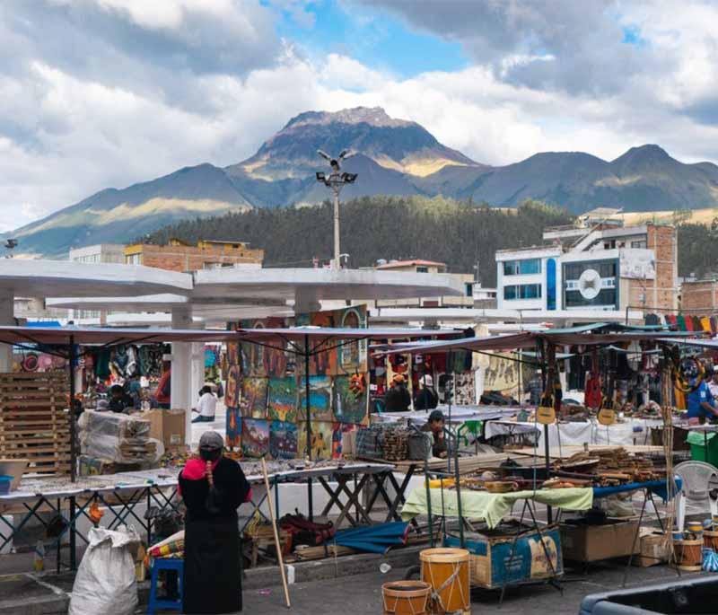 Otavalo Market, one of the largest indigenous markets in South America, known for its colorful textiles and handicrafts.