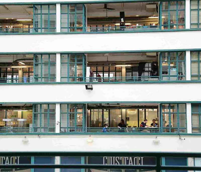 PMQ in Hong Kong, a creative hub offering art exhibitions, design shops, and workshops in a historical building.
