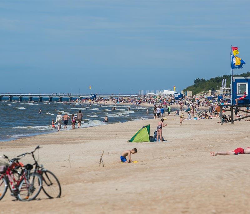 Palanga Beach, a popular seaside destination known for its sandy beaches, lively boardwalk, and summer festivals.