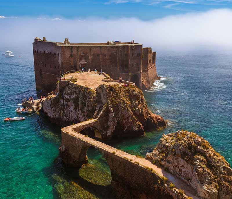 Peniche - A coastal town known for its surf spots, historic fort, and the nearby Berlengas archipelago, a nature reserve.