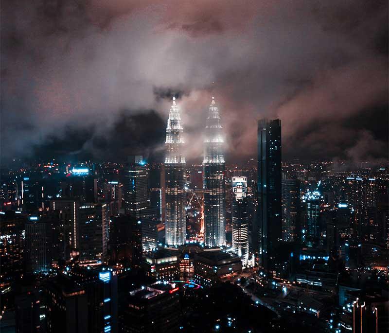Petronas Twin Towers in Kuala Lumpur offer breathtaking city views and architectural marvels, a must-see for any visitor.