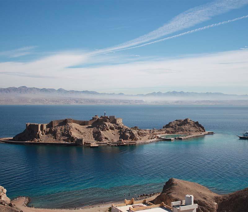 Pharaoh's Island, a small island in the Gulf of Aqaba with a Crusader fortress, offering snorkeling and stunning views.